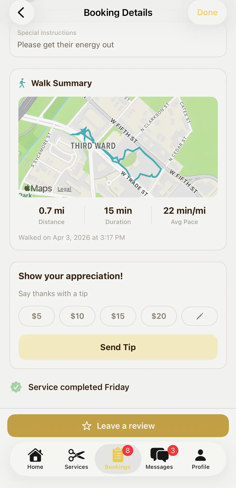 Pawprint booking details showing a completed walk summary with the GPS route, distance and duration, a tip option, and a leave-a-review button